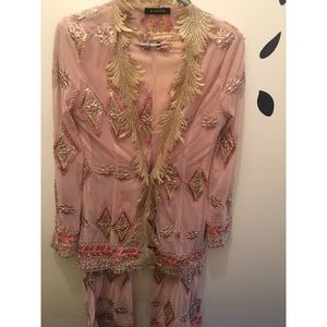 Two piece long sleeve open top and matching pants.